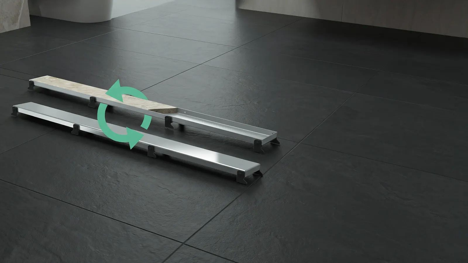 Two Luxdrain STR drains, one grate turned steel side up, the other with a tile insert
